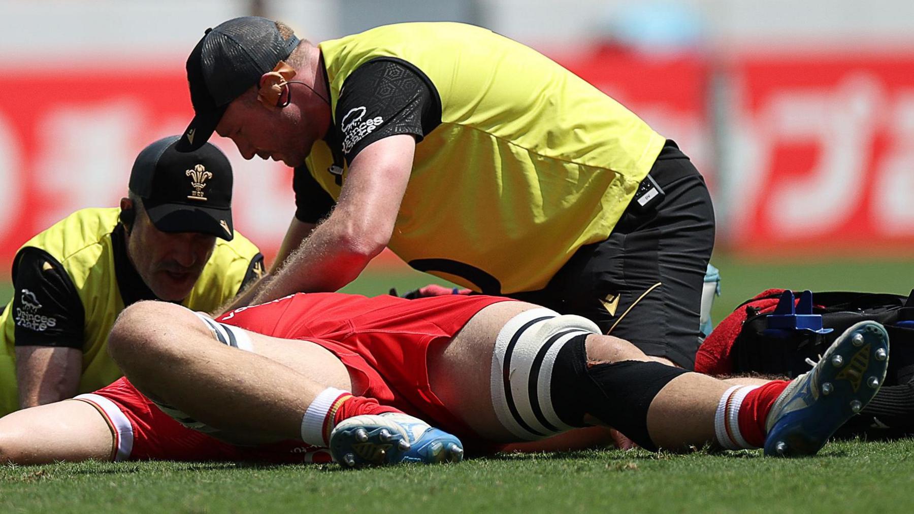 Ben Carter receives treatment on the field