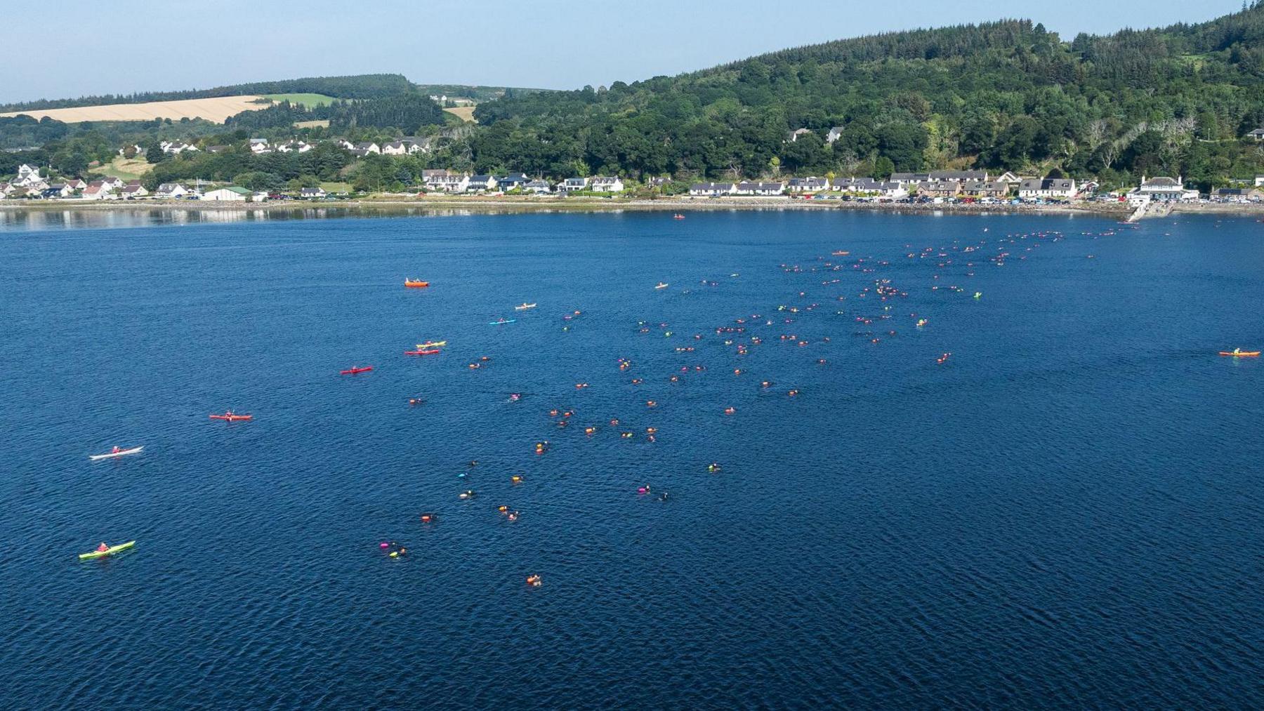 An aerial drone image showing the water of the Kessock Channel and swimmers