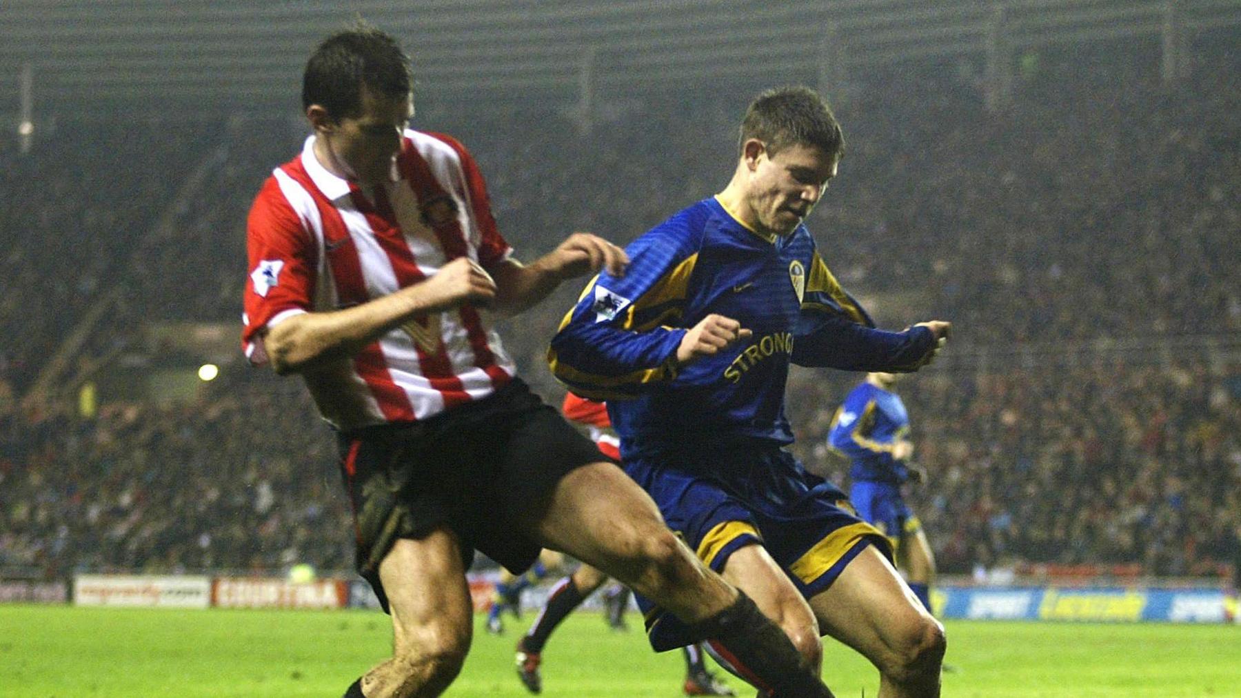 James Milner (wearing blue) playing for Leeds in December 2002.