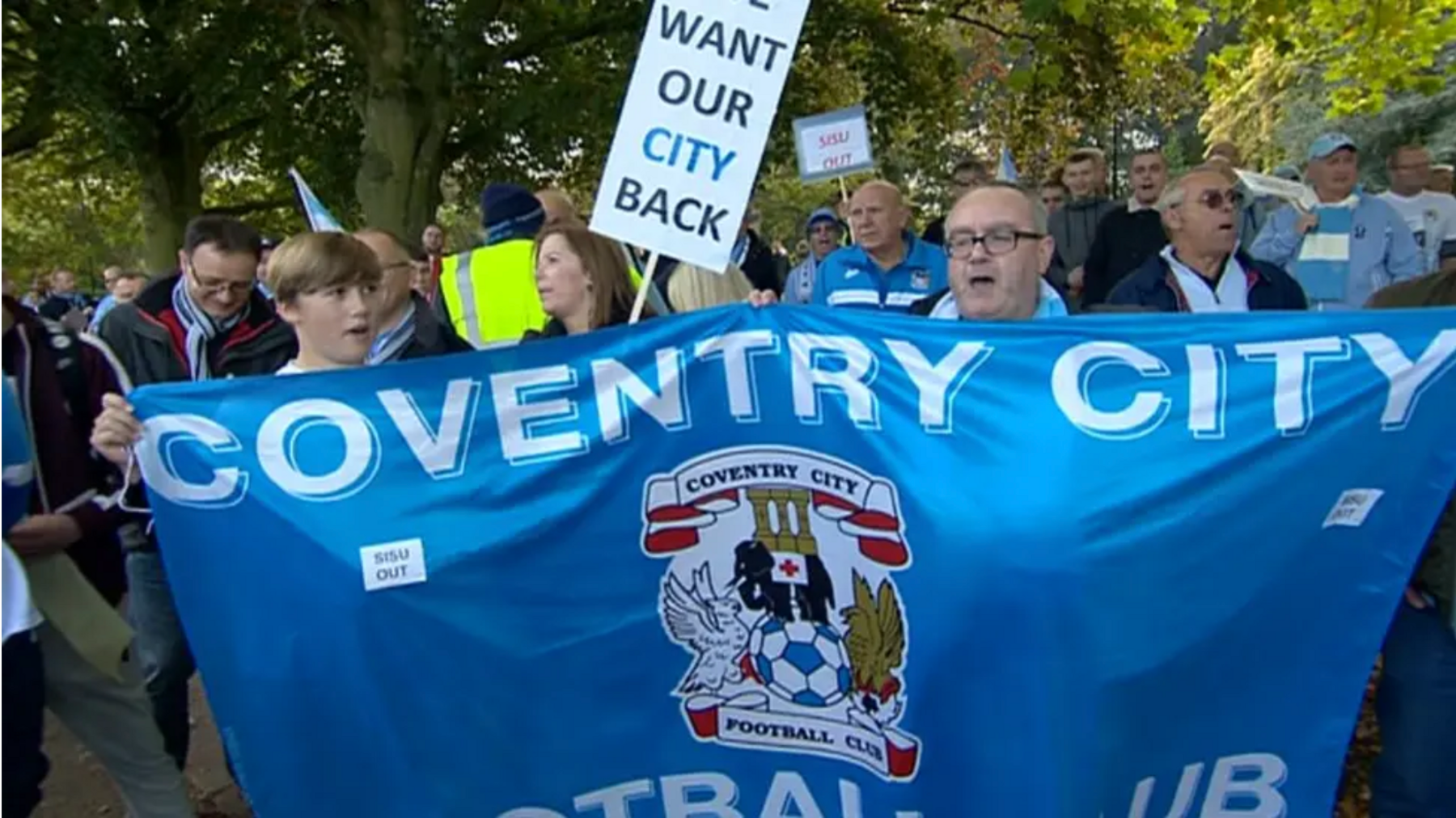 Image showing Coventry City fans taking part in protests as the club spent years away from the city during previous stadium disputes. Fans hold signs saying "we want our city back".