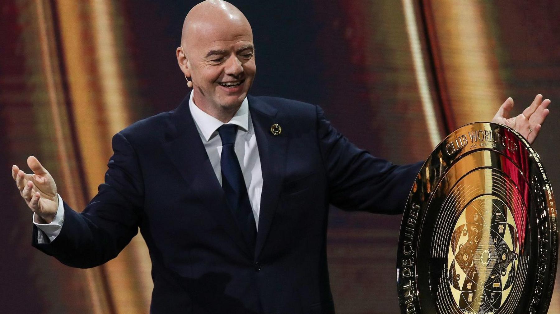 Fifa president Gianni Infantino with trophy