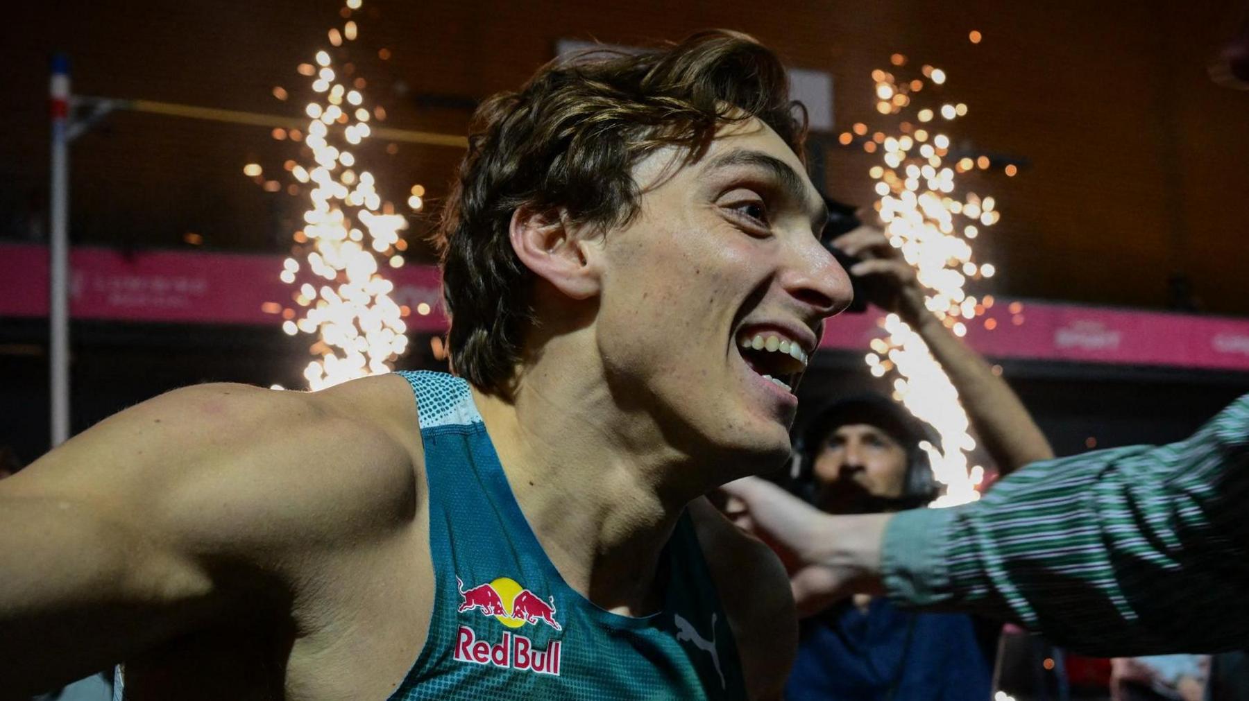 Armand Duplantis celebrates breaking the men's pole vault world record at All Star Perche