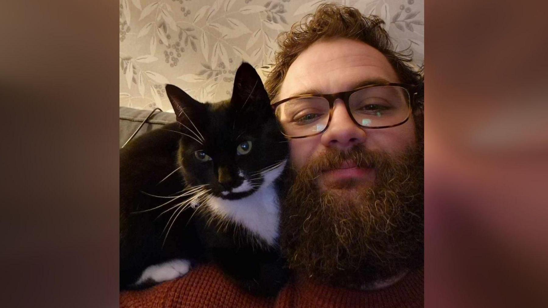 Nathan Fletcher with his cat Smudge 