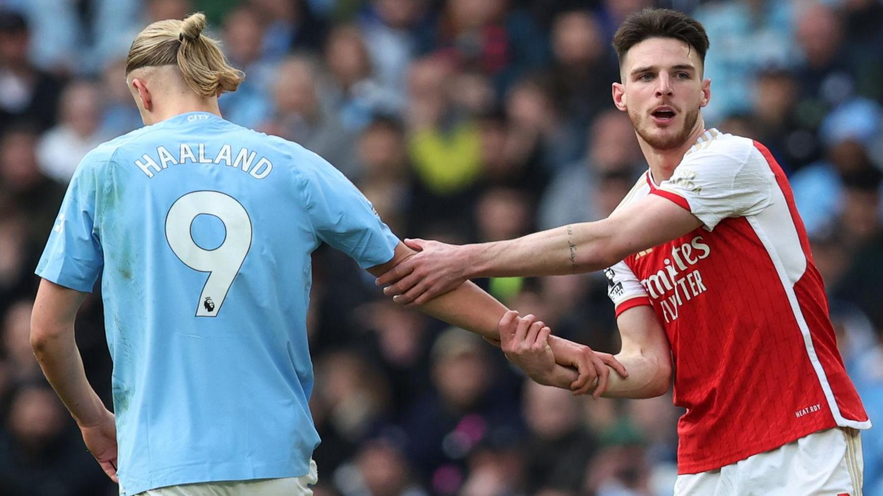 Arsenal's Declan Rice shakes hands with Manchester City's Erling Haaland