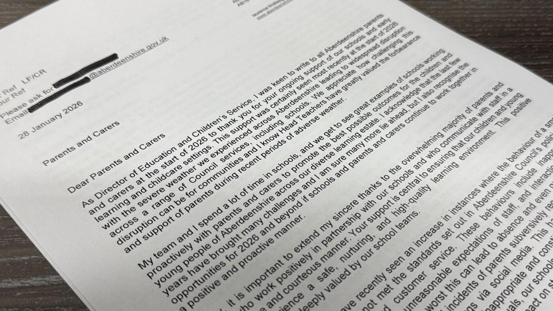 The letter is laid out on the table. Its words explain Aberdeenshire Council's position on the recording of teachers and other alleged behaviour by a "small minority" of parents.