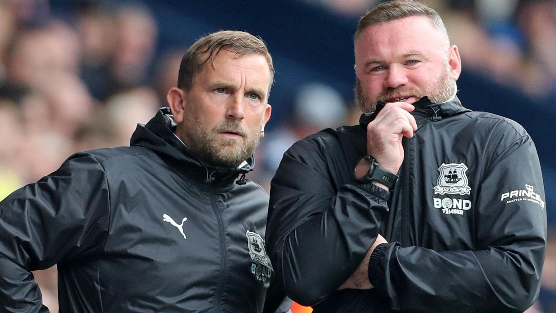 Peter Shuttleworth (left) watches a game with Wayne Rooney