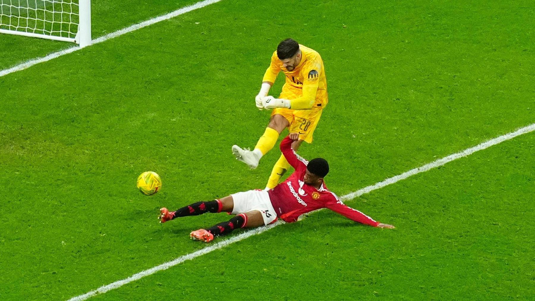 Fraser Forster is tackled by Amad Diallo for Manchester United's second goal