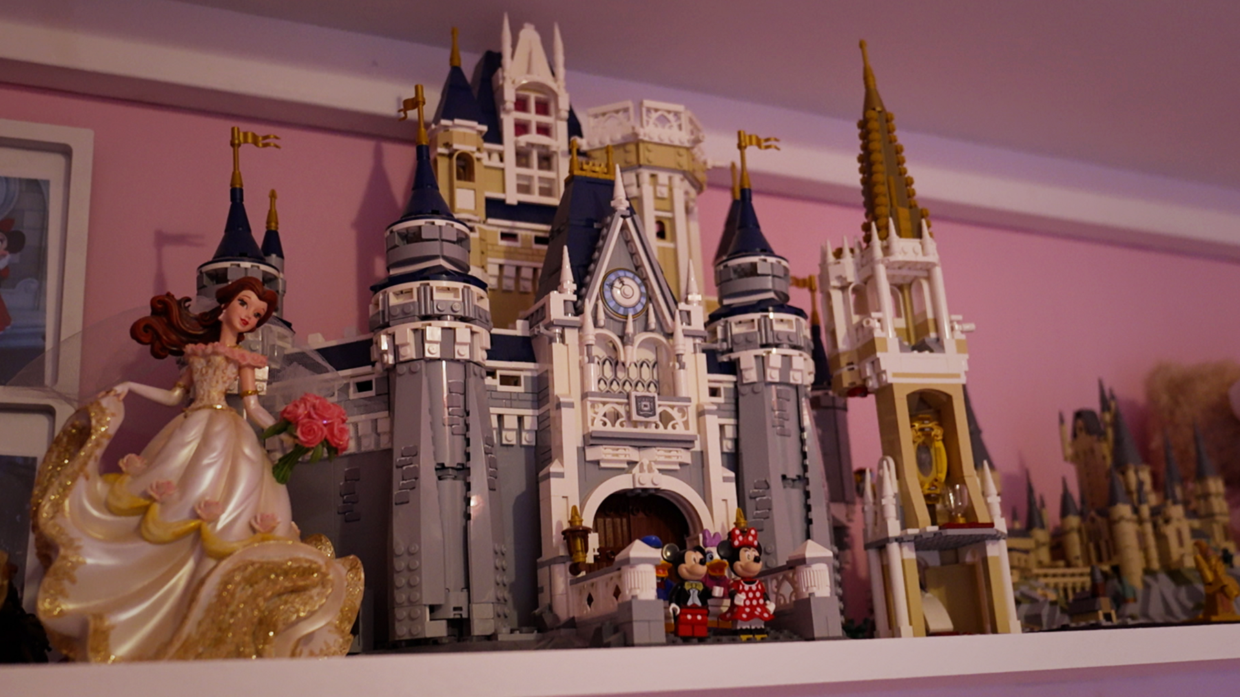 A Lego castle next to a Disney princess doll