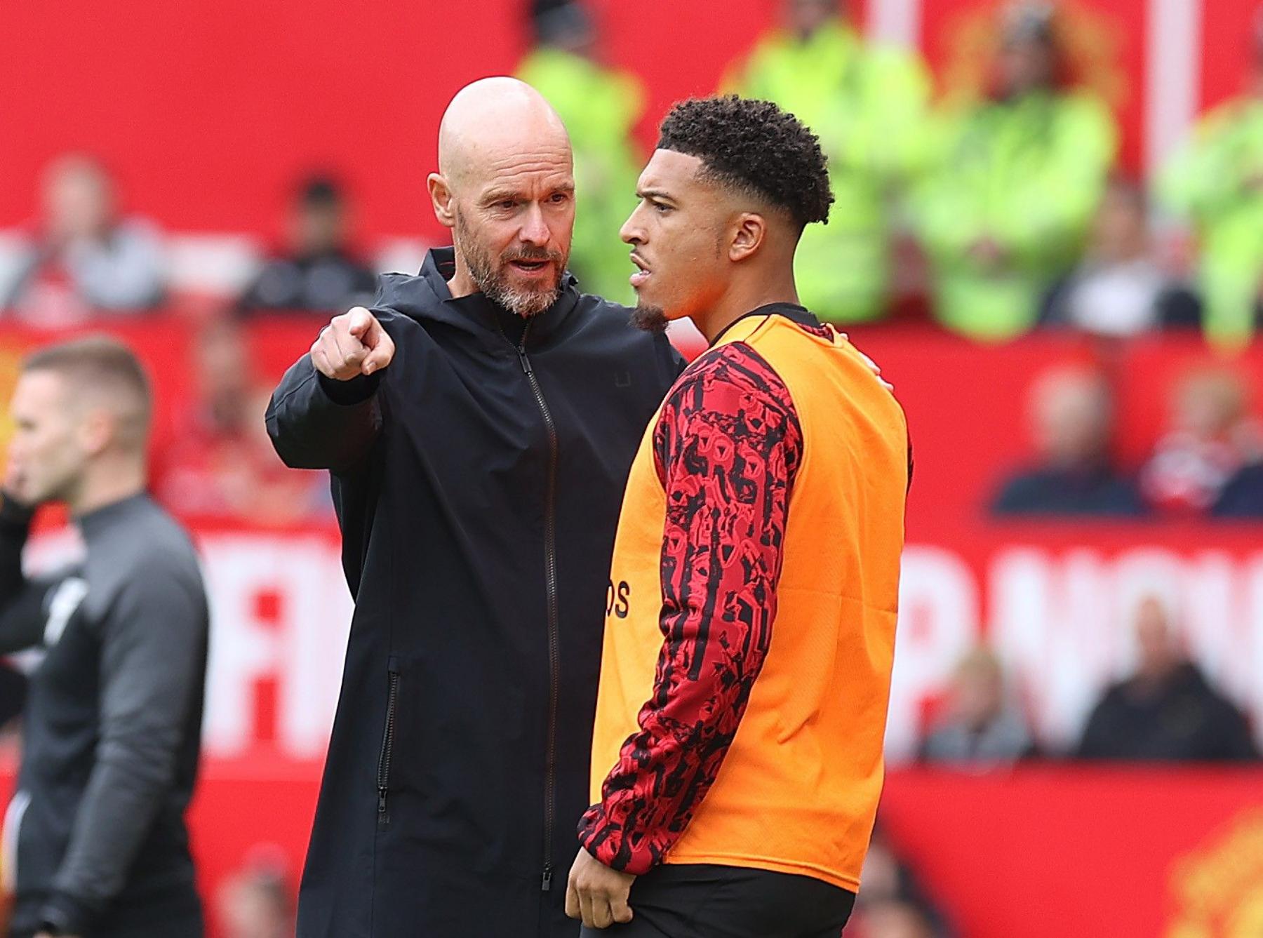 Erik ten Hag gives instructions to Jadon Sancho on the sideline