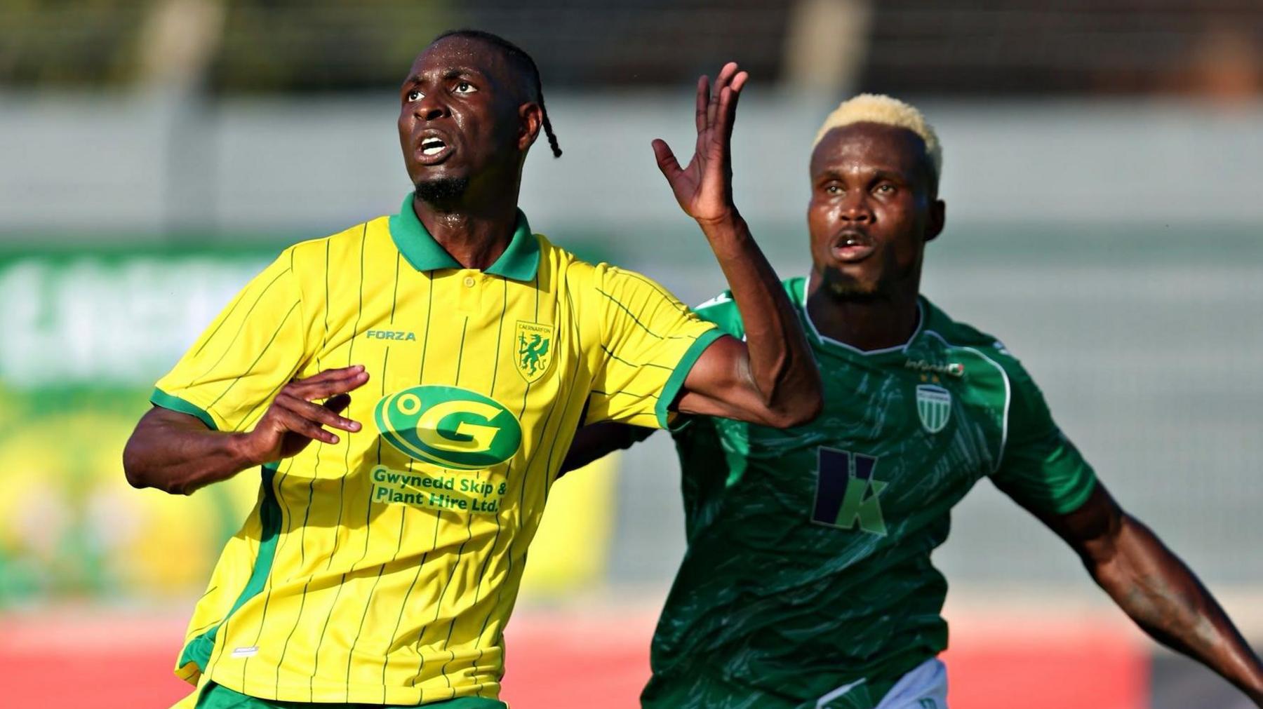 Caernarfon's Paulo Mendes battles with Abraham Nwankwo of Levadia Tallinn