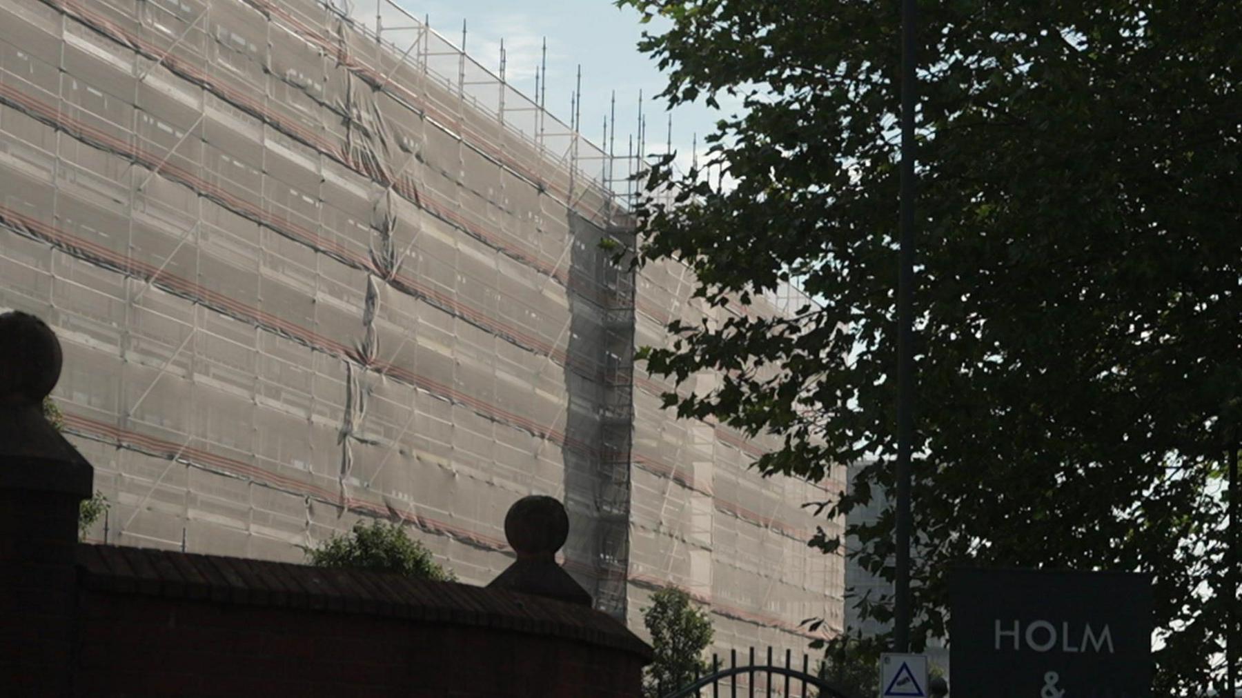 A view of the block of flats in Pendleton with netting on the surface