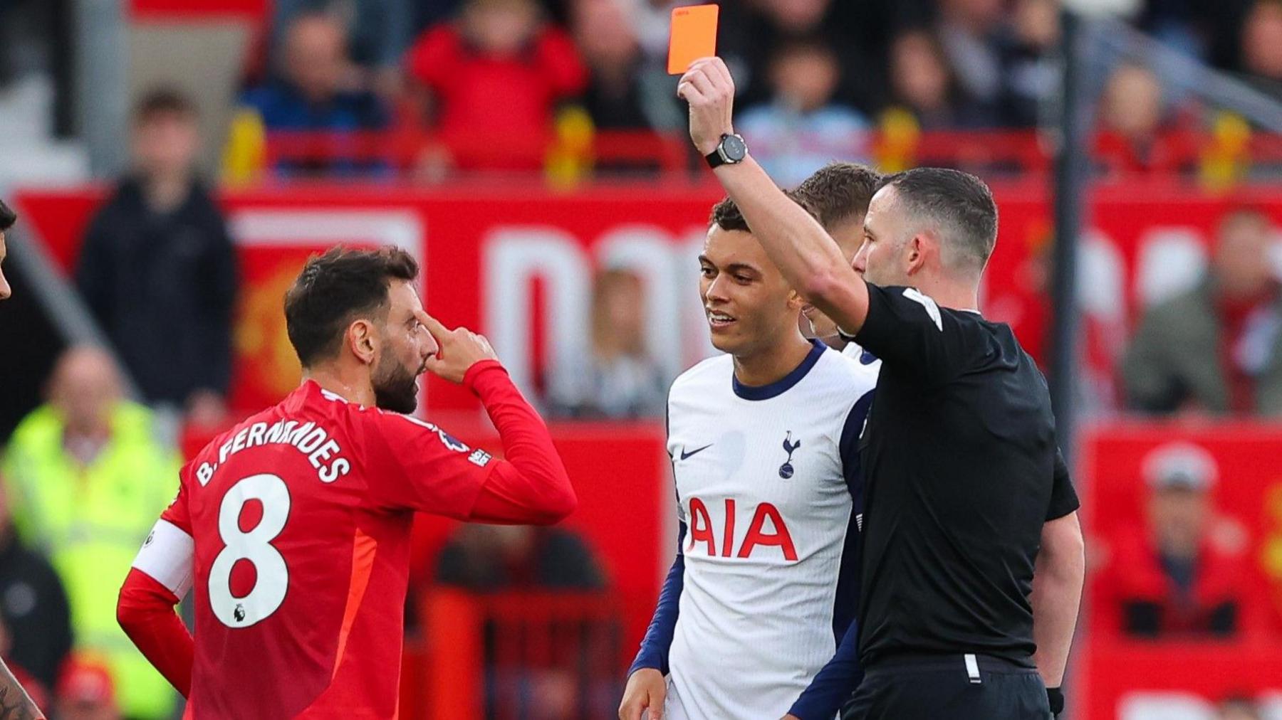 Manchester United's Bruno Fernandes is sent off in a Premier League match against Tottenham at Old Trafford