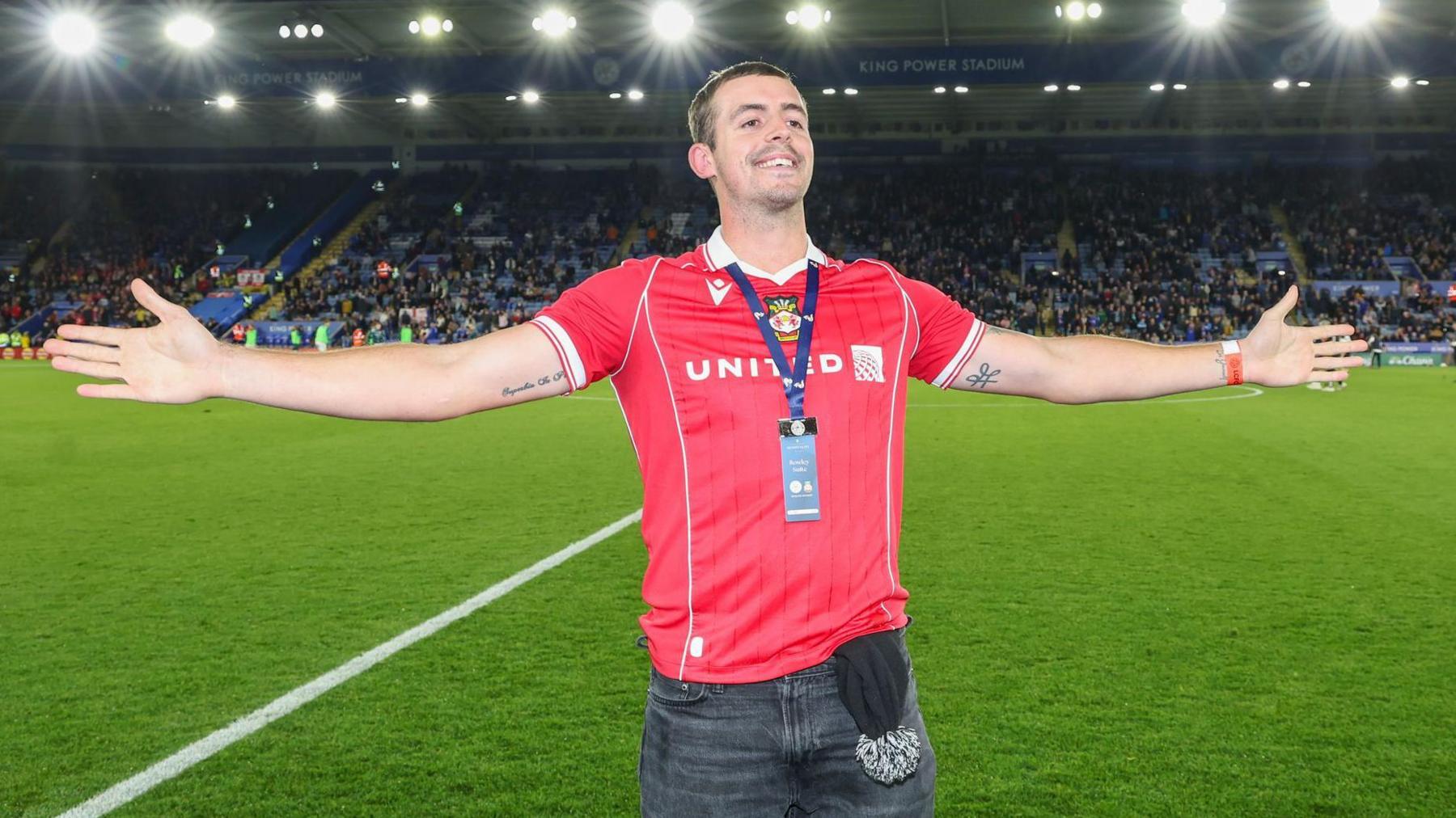 Leicestershire cricketer Roman Walker in a Wrexham AFC shirt at the trophy during half time interval of the EFL Sky Bet Championship match between Leicester City and Wrexham FC at the King Power Stadium, Leicester,
30 Sep 2025