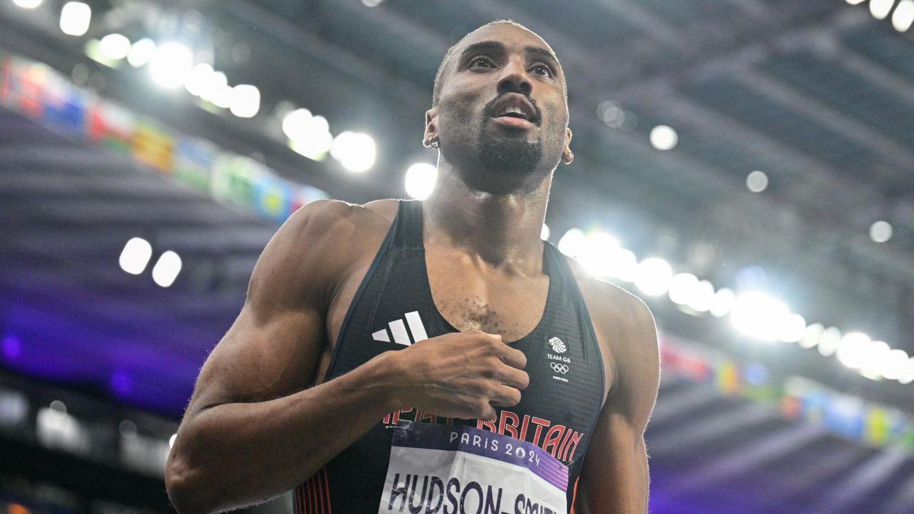 A man with a black Team GB running top with the name "Hudson-Smith" on the front.