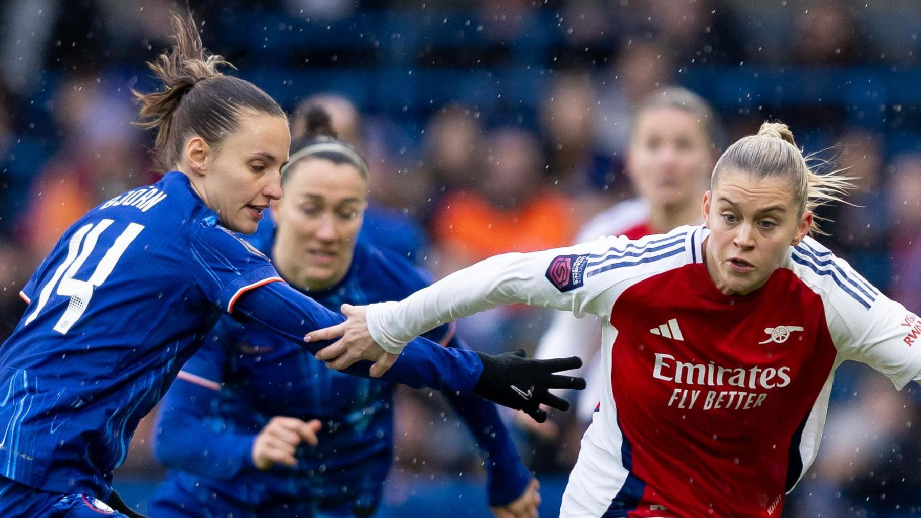 Nathalie Björn of Chelsea and Alessia Russo of Arsenal compete for the ball