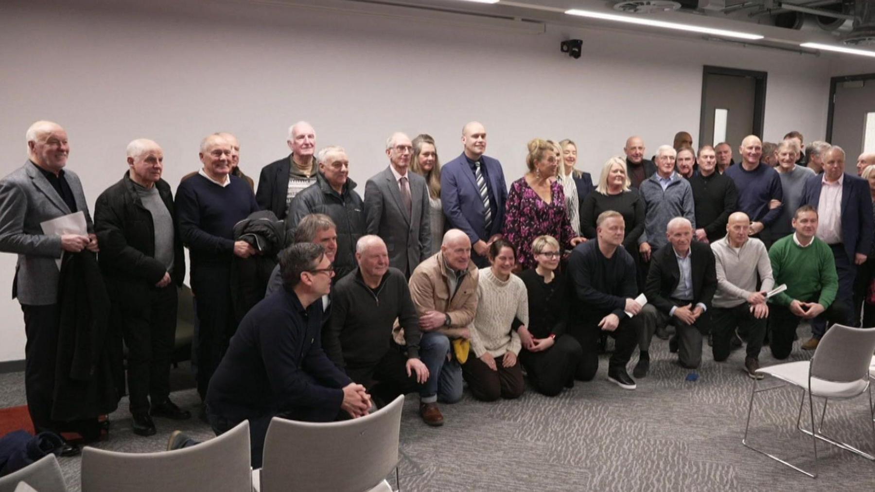 Former footballers line up with Metro mayors Andy Burnham (front row left) and Steve Rotheram (front row second left).