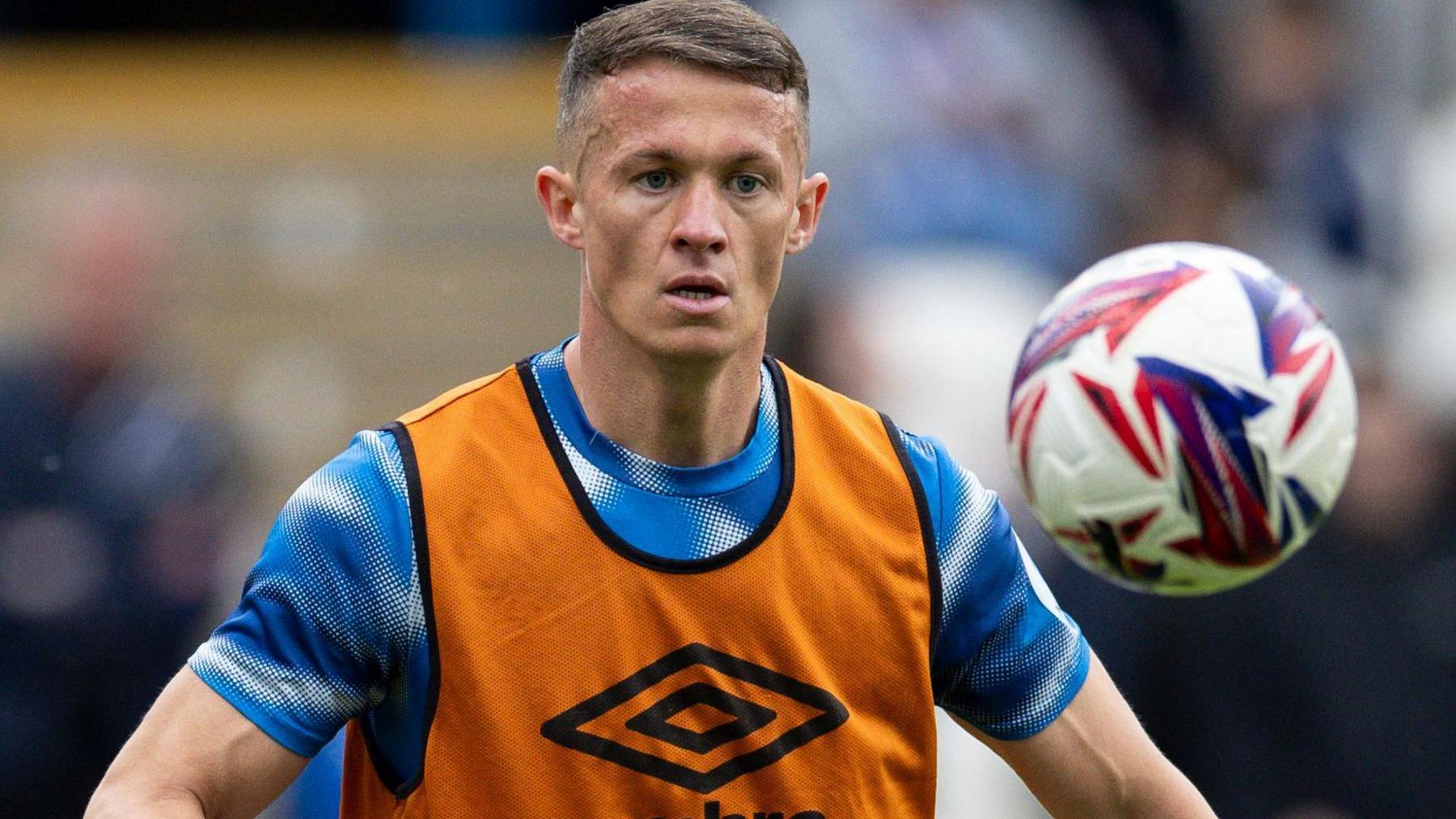 Jonathan Hogg warms up before a match for Huddersfield Town
