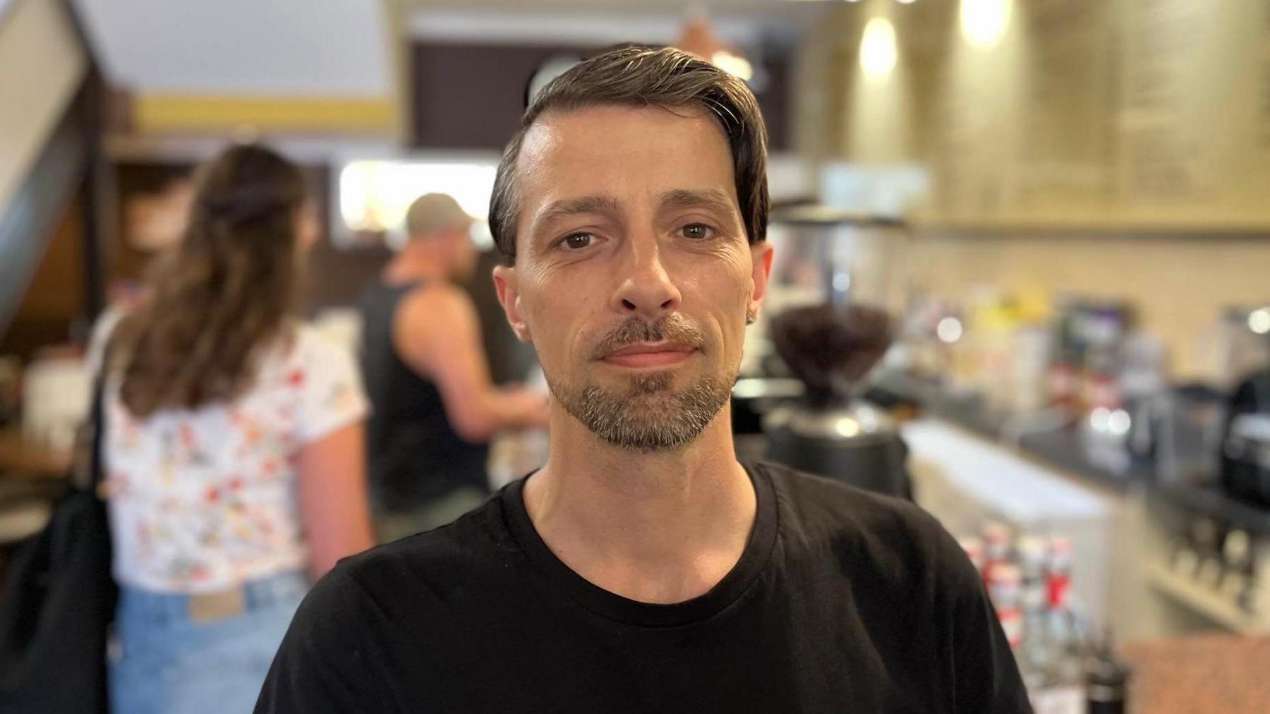 Bites cafe manager Mirko Laganaro stood inside his cafe