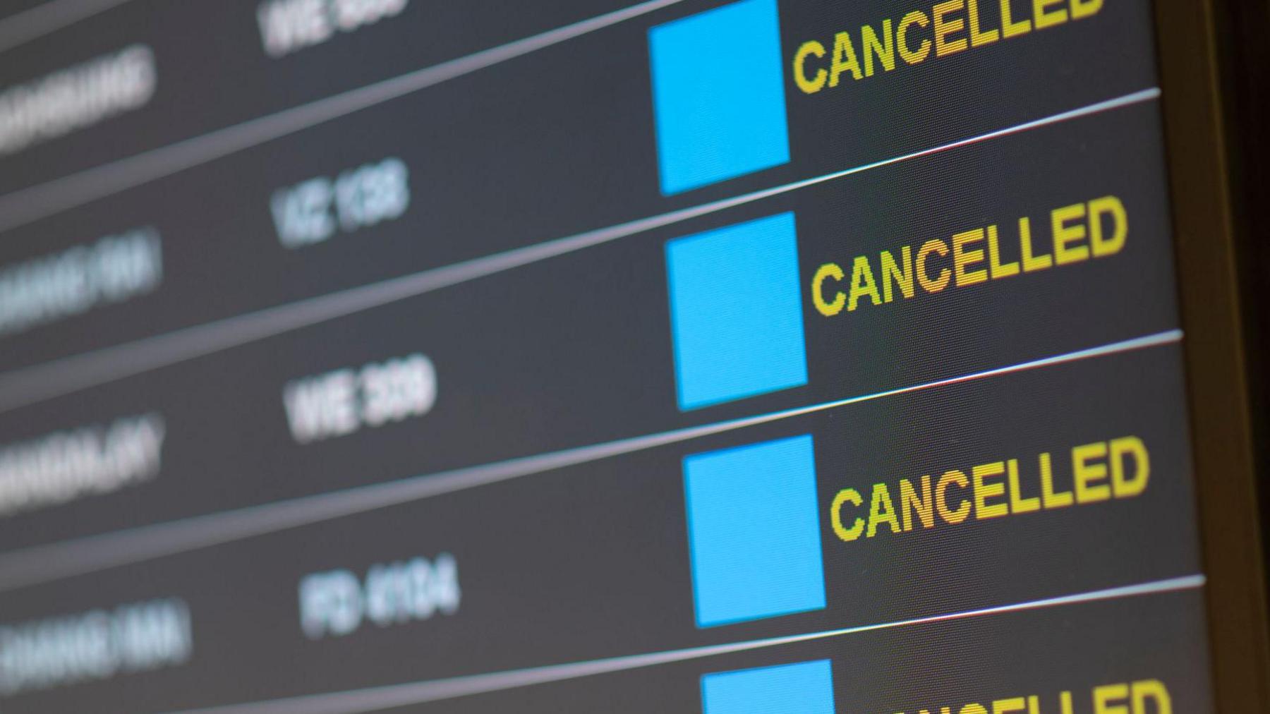 A board showing cancelled flights 