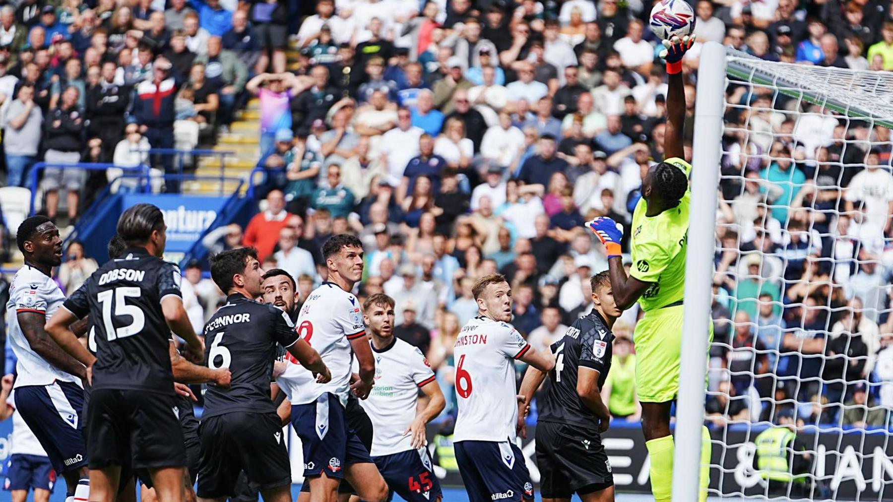 Wrexham goalkeeper Arthur Okonkwo made a string of good saves against Bolton