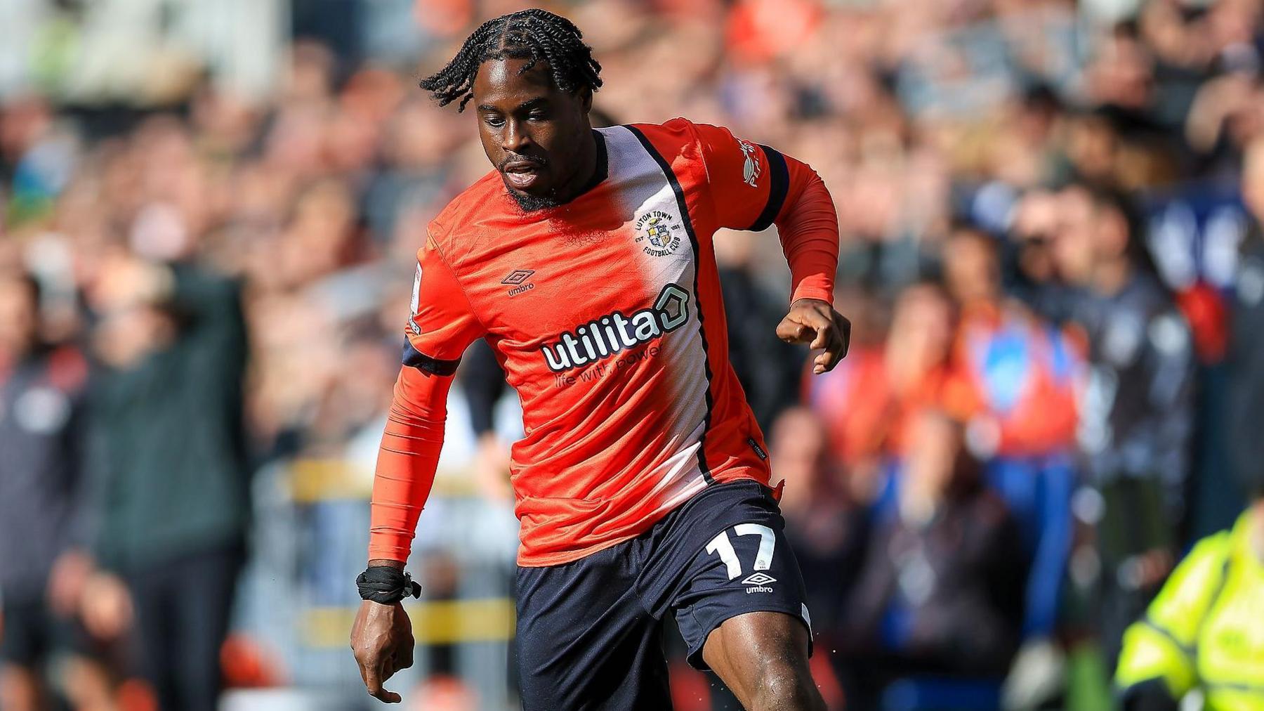 Pelly Ruddock Mpanzu with the ball during a game for Luton this season