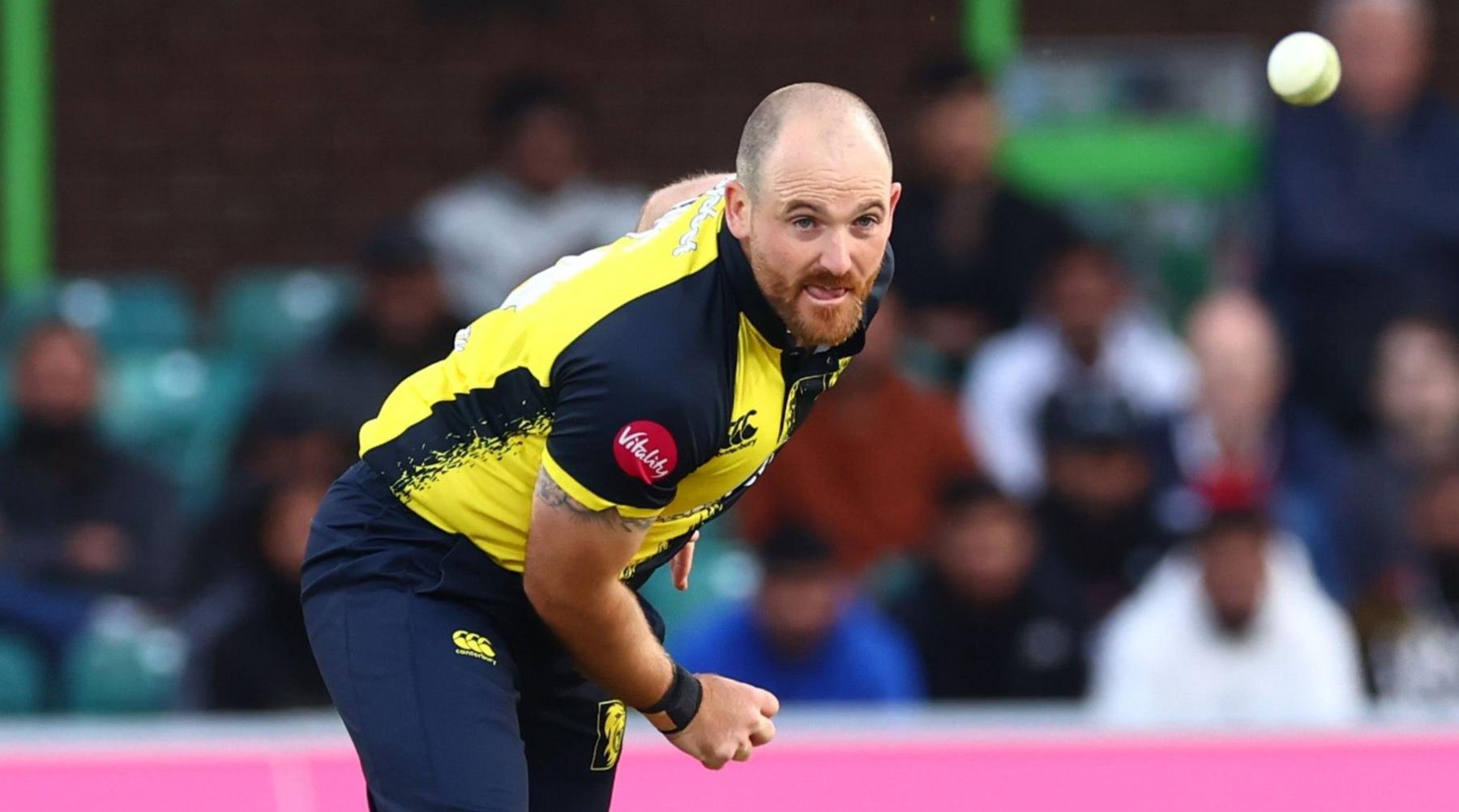 Durham's Ben Raine bowls a delivery