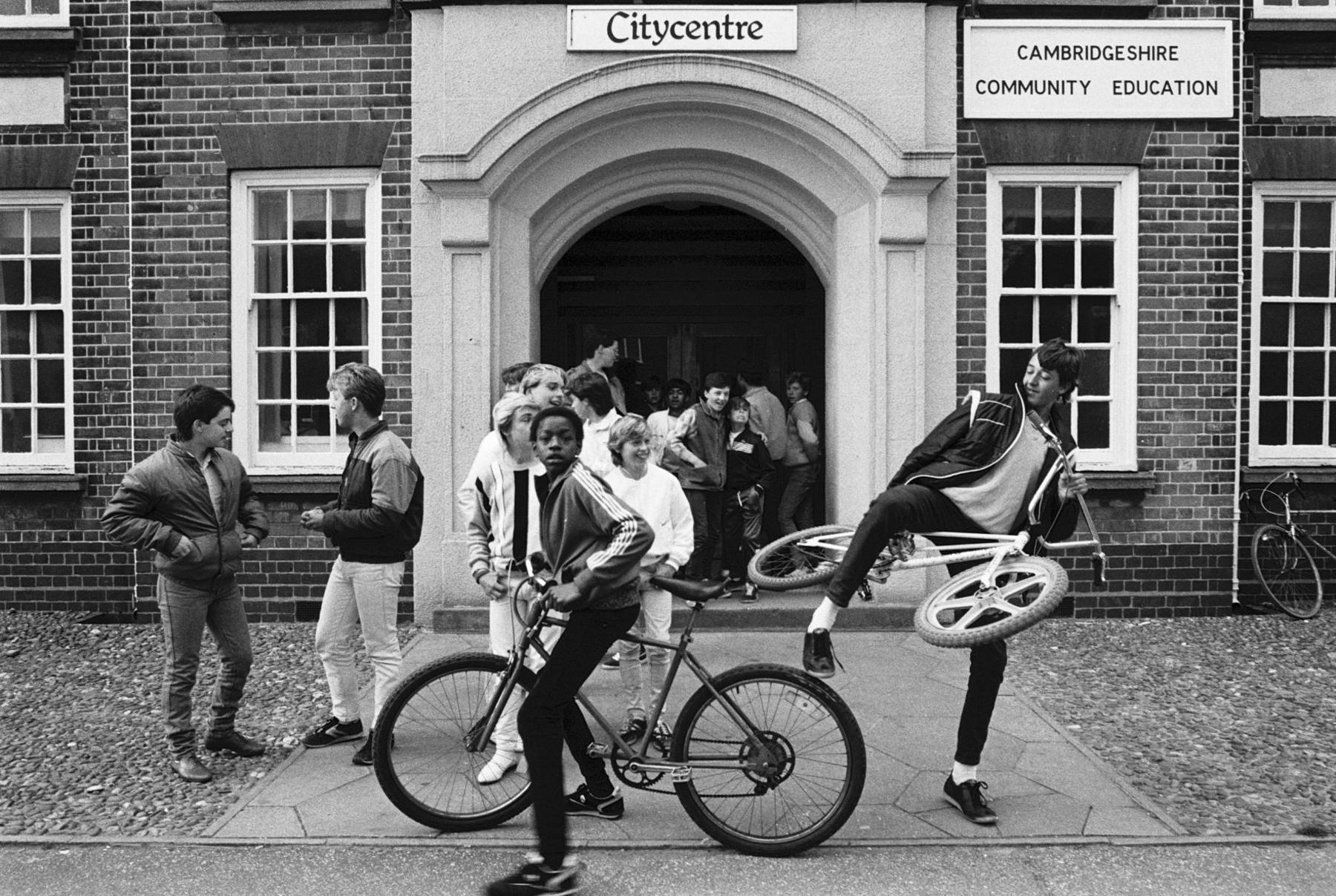 Members of the Friday Club crowd around the entrance of the City Centre building as they wait for it to be opened in Peterborough, 1985.