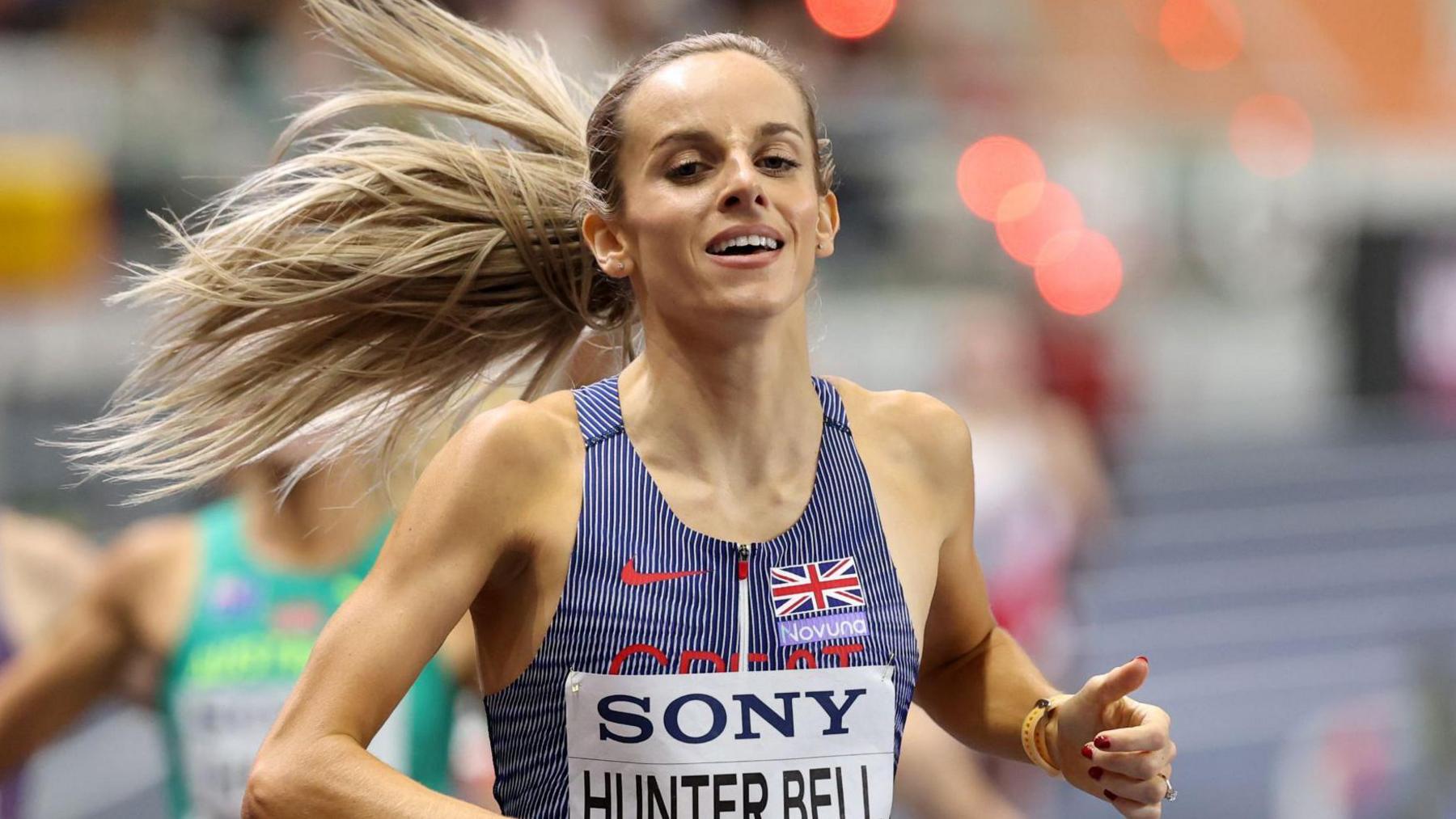 Georgia Hunter Bell crosses the line for world indoor 1500m gold