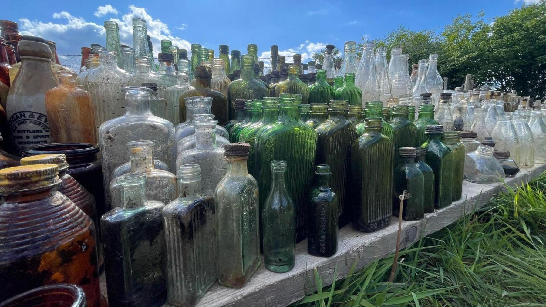 Close up on the clear end green bottles