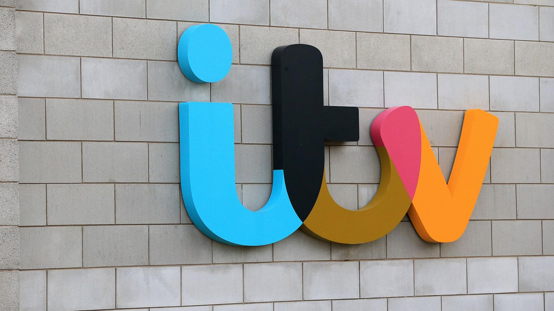 Colourful ITV logo on the side of ITV studios in Salford
