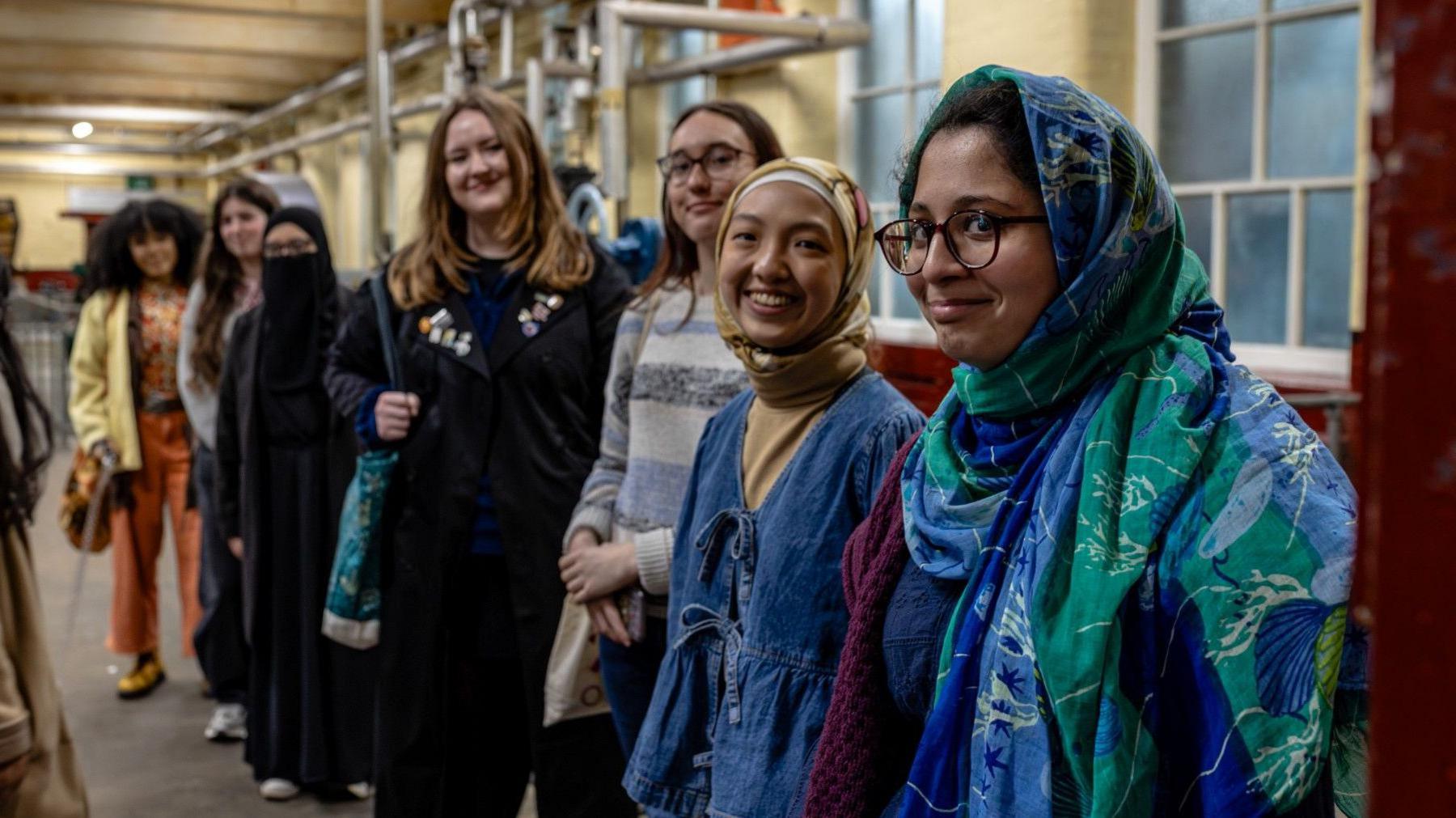 A group of young adults posing for a picture at Bradford Industrial Museum.