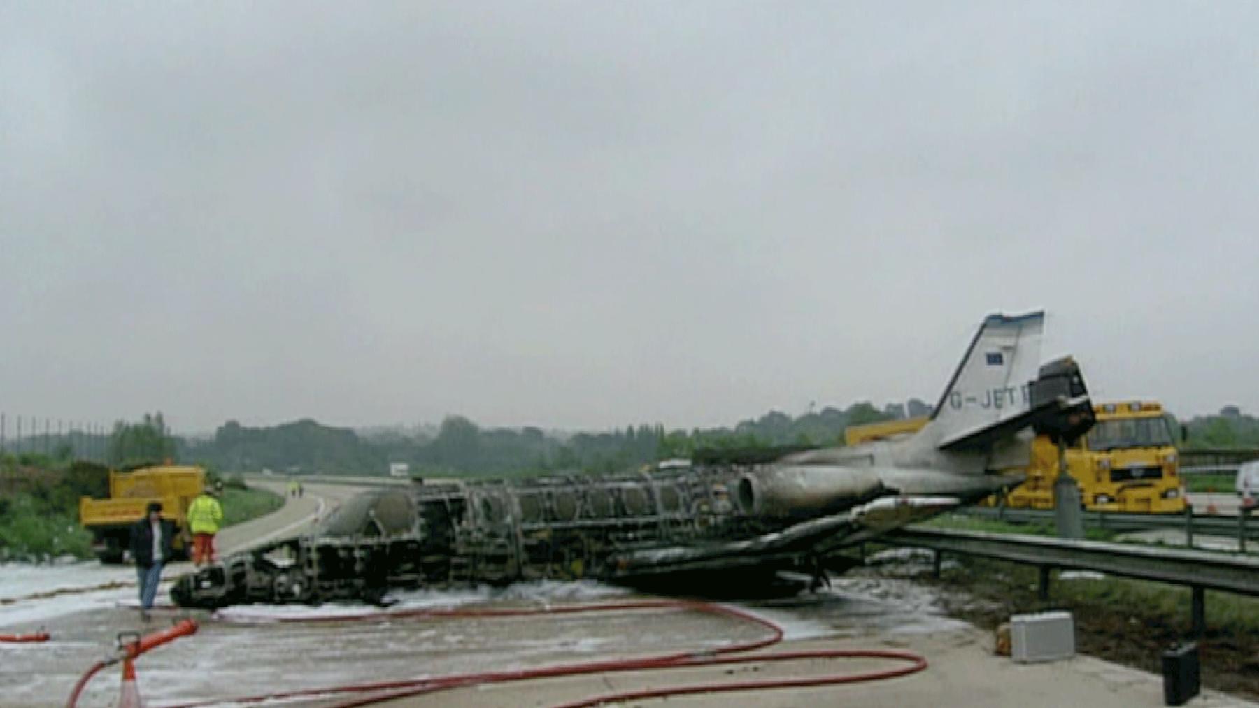 A Cessna Jet crashed onto the motorway. It is in one piece but is mostly burnt out.