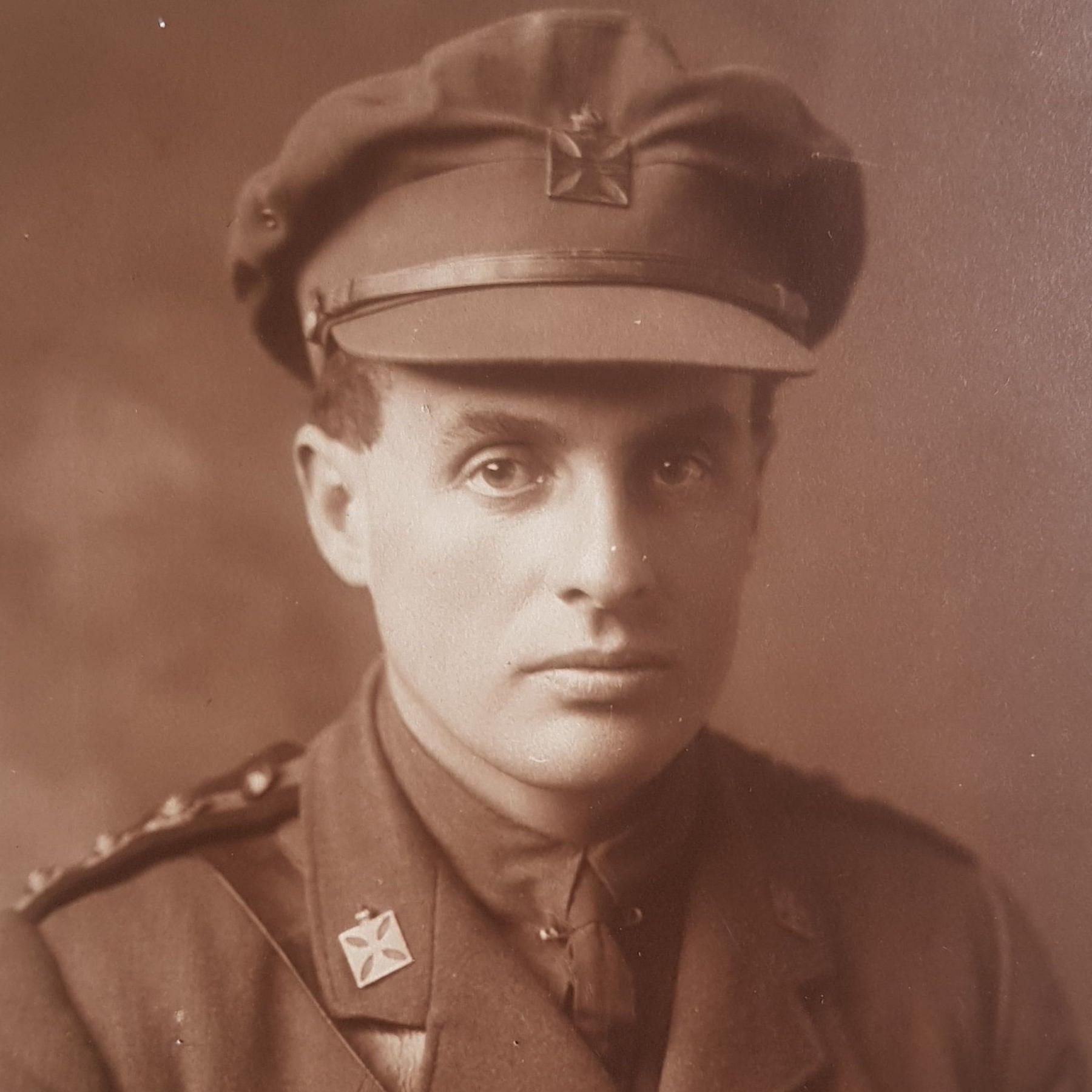 Sepia-toned image of the Reverend David Railton wearing an army uniform and cap