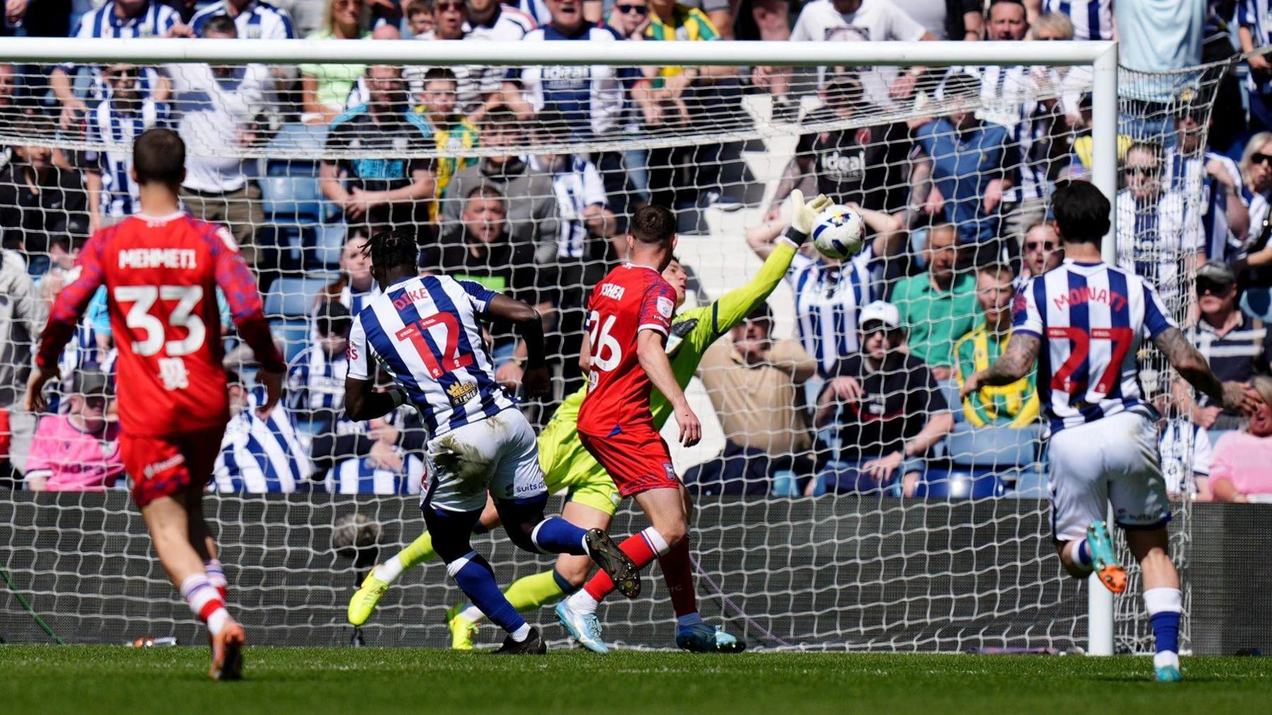 West Bromwich Albion's Daryl Dike has a shot saved by Ipswich goalkeeper Christian Walton