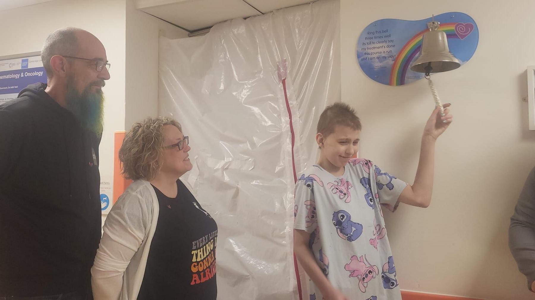 Bethany ringing the cancer free bell at Addenbrooke's Hospital