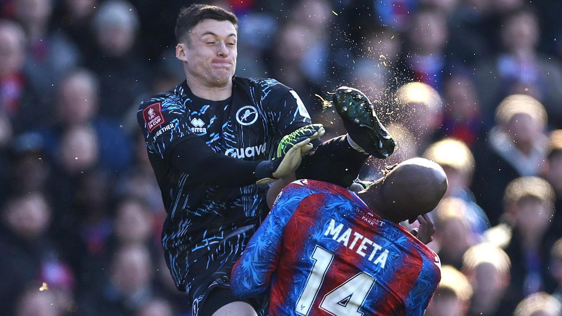 Liam Roberts clashes with Jean-Philippe Mateta