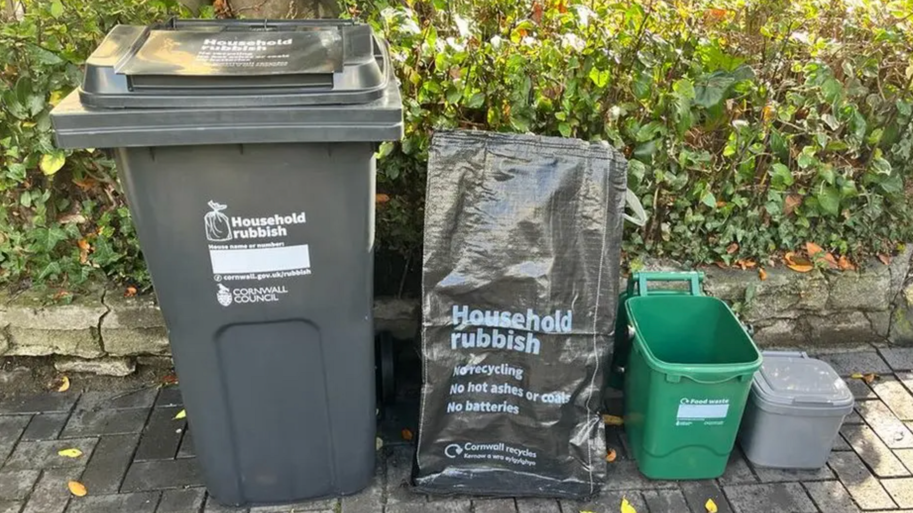 Four types of bins on a driveway