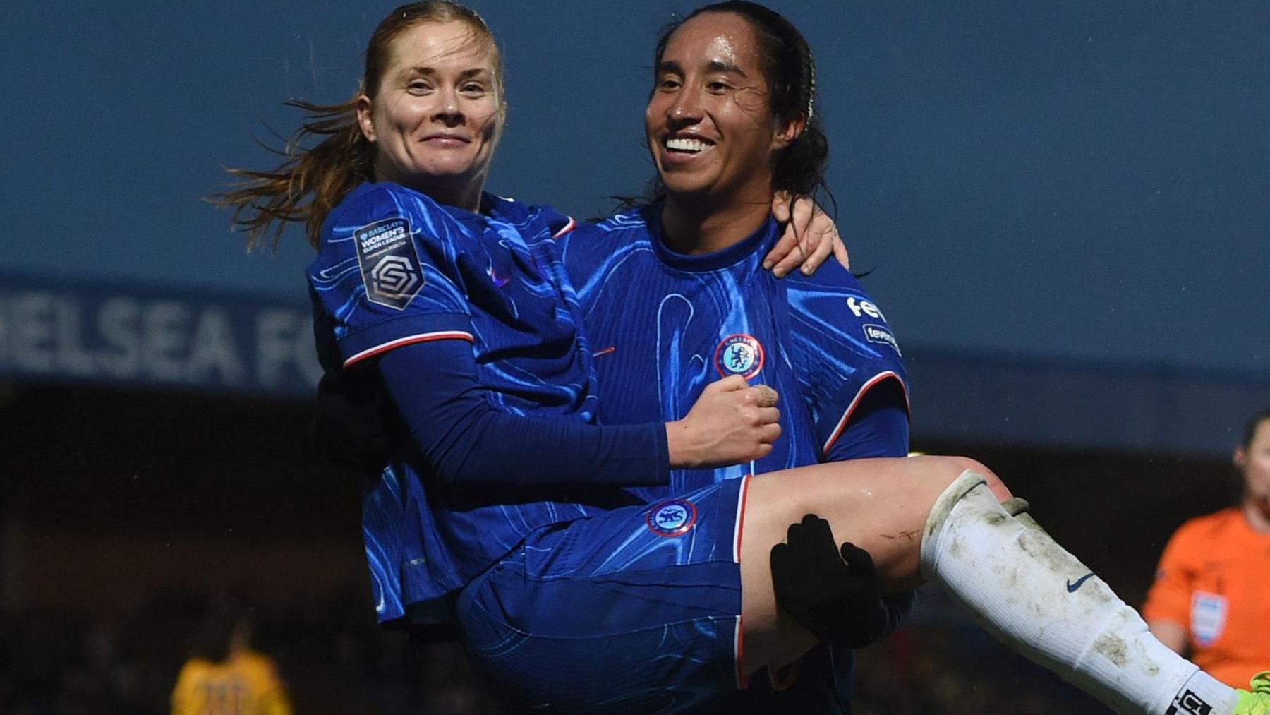 Chelsea player Mayra Ramirez lifts up Sjoeke Nusken to celebrate a goal in the WSL match against Brighton in December 2024