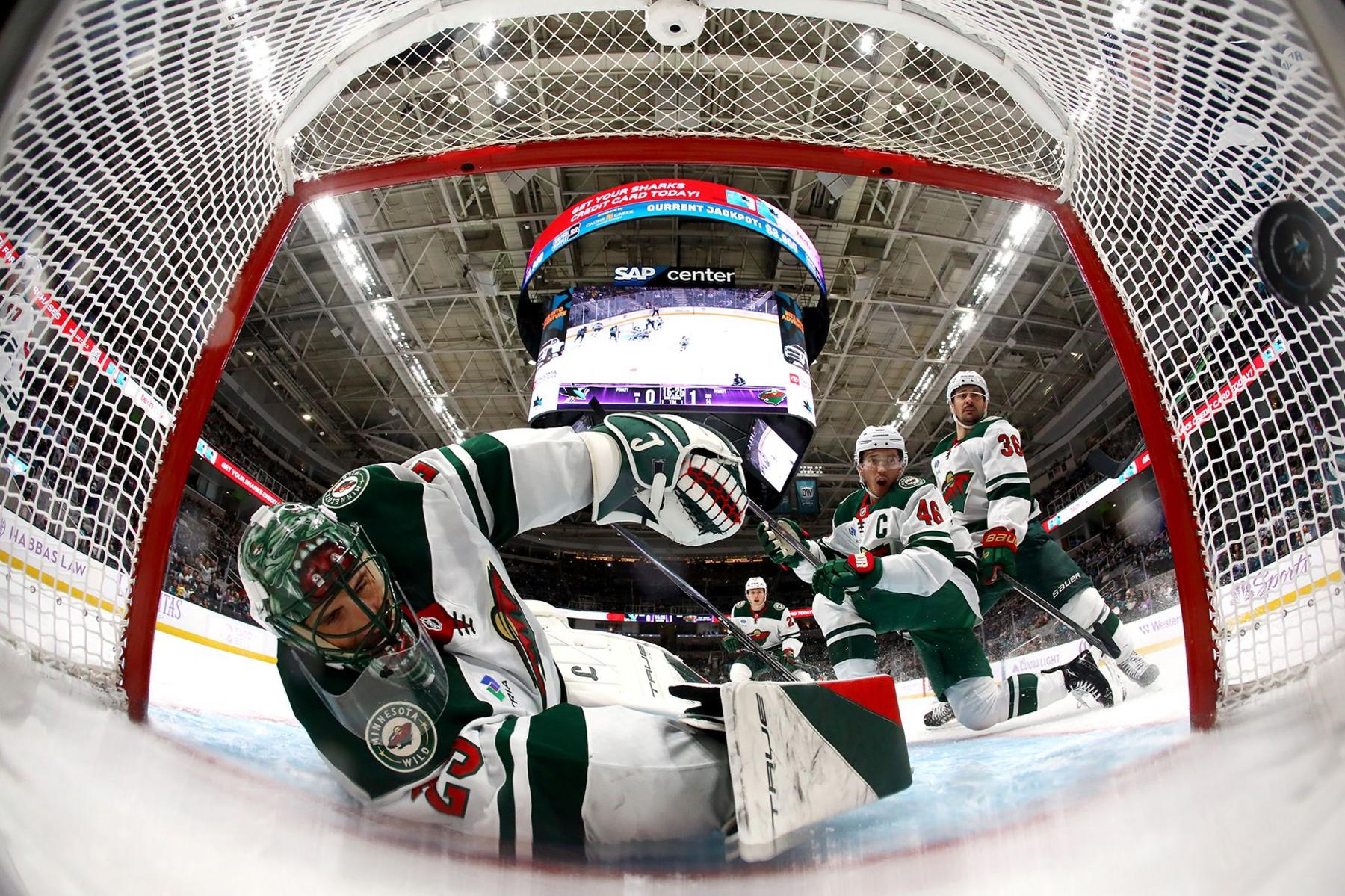 Goalie Marc-Andre Fleury, Jared Spurgeon and Mats Zuccarello of the Minnesota Wild watch the puck go into the net after a shot taken by Macklin Celebrini of the San Jose Sharks in the second period at SAP Center on 7 November 2024 in San Jose, California.