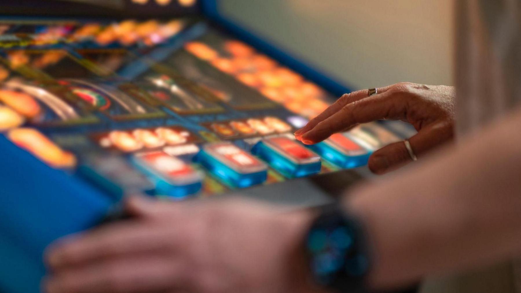 A person using a gambling machine