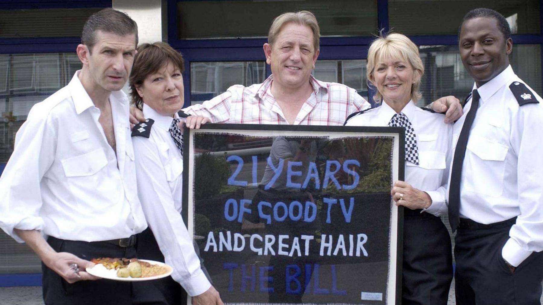 File photo of The Bill actors (left to right) Jeff Stewart, Roberta Taylor, Mark Wingett, Trudie Goodwin and Cyril Nri, with an artwork - saying 21 years of good TV and great hair The Bill - given to the ITV show by artist Tracey Emin to celebrate the police drama's 21st anniversary at their studio in south London.