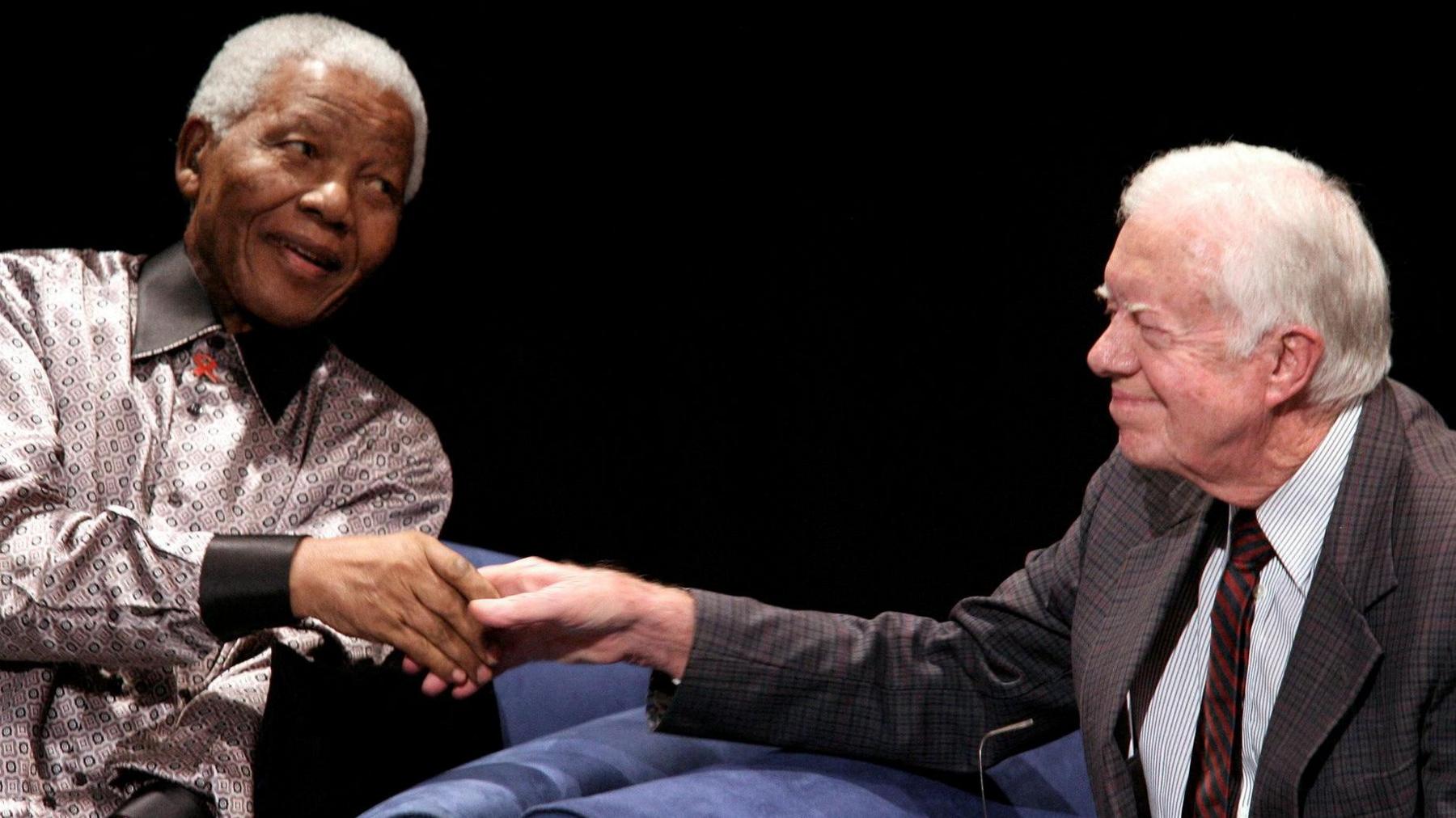 Jimmy Carter shaking hands with Nelson Mandela