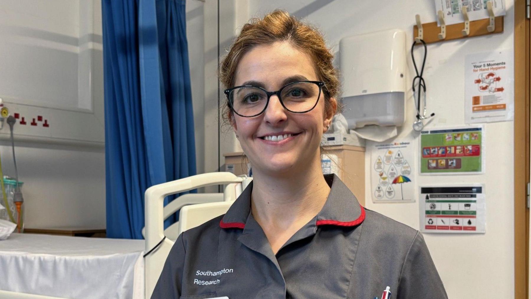 Smiling nurse Inês Rodrigues inside the clinical trials unit at University Hospital Southampton 