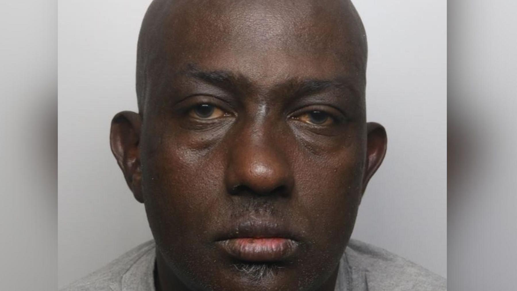 Police picture of a defendant in a grey top