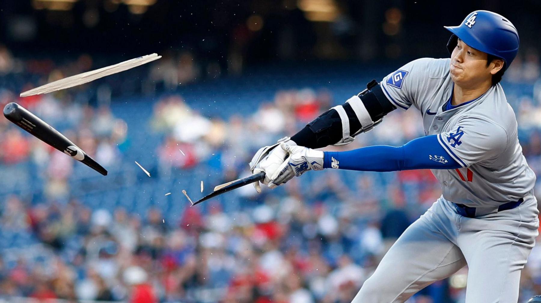 Los Angeles Dodgers designated hitter Shohei Ohtani shatters his bat while hitting a ground ball against the Washington Nationals during the first inning at Nationals Park, Washington DC