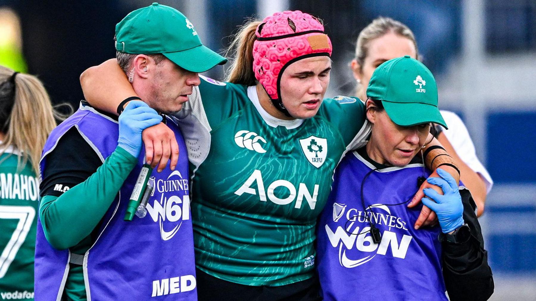 Dorothy Wall is helped off the field