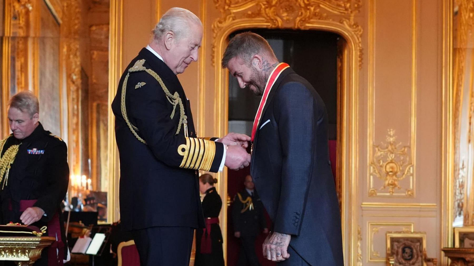 Sir David Beckham is knighted by King Charles III during an investiture ceremony at Windsor Castle, Berkshire on 4 November 2025.