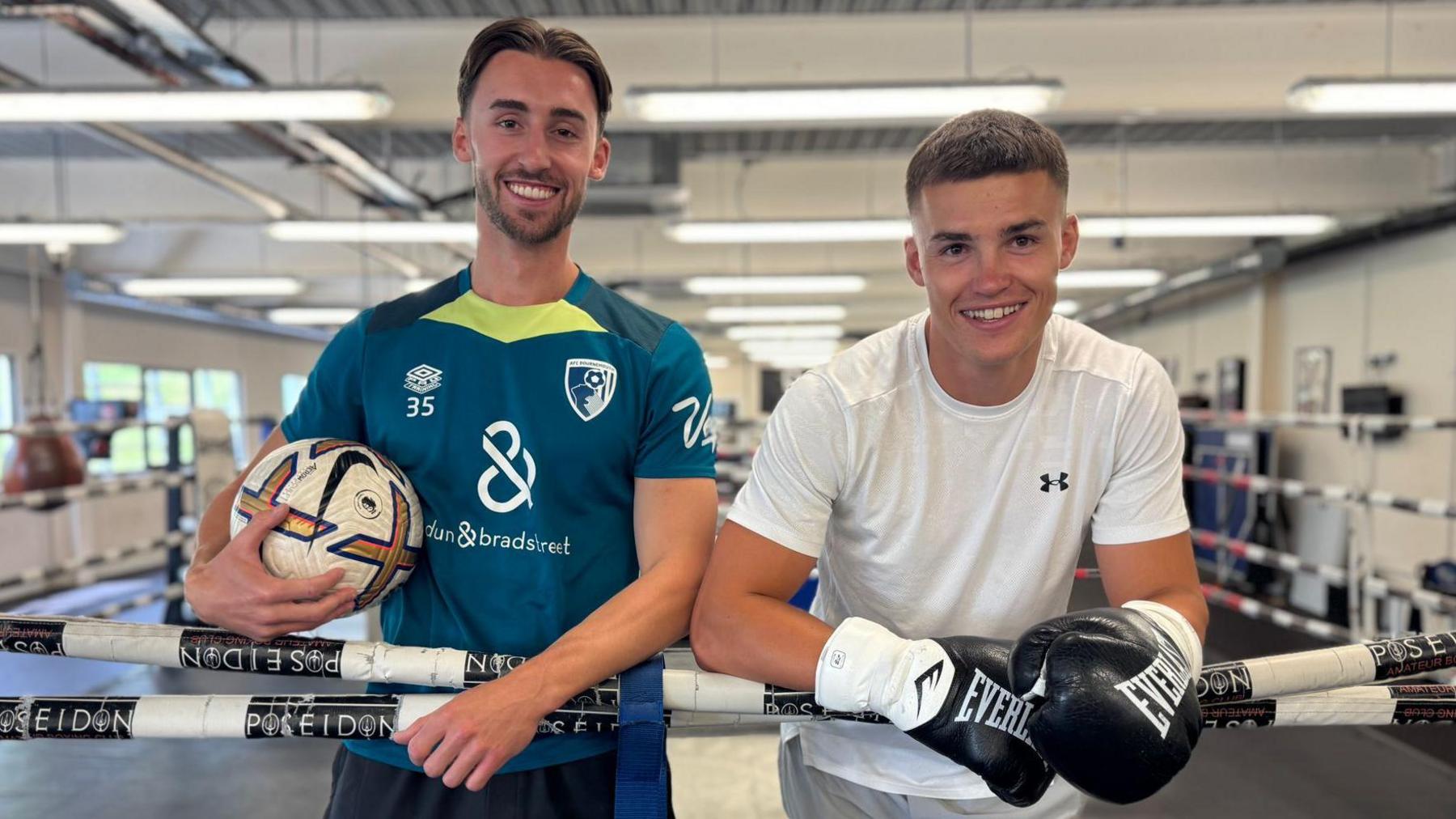 Owen and Taylor Bevan pose for a photo while standing inside a boxing ring