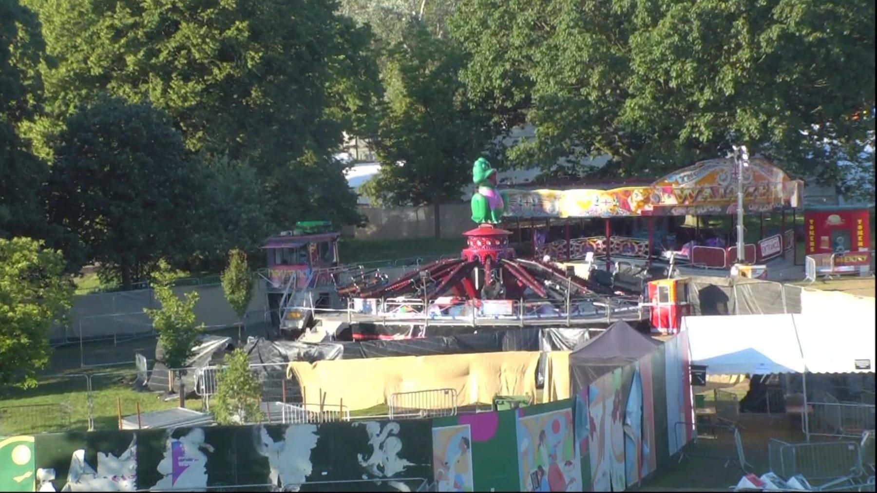 Tarpaulin around a fairground ride in Brockwell Park