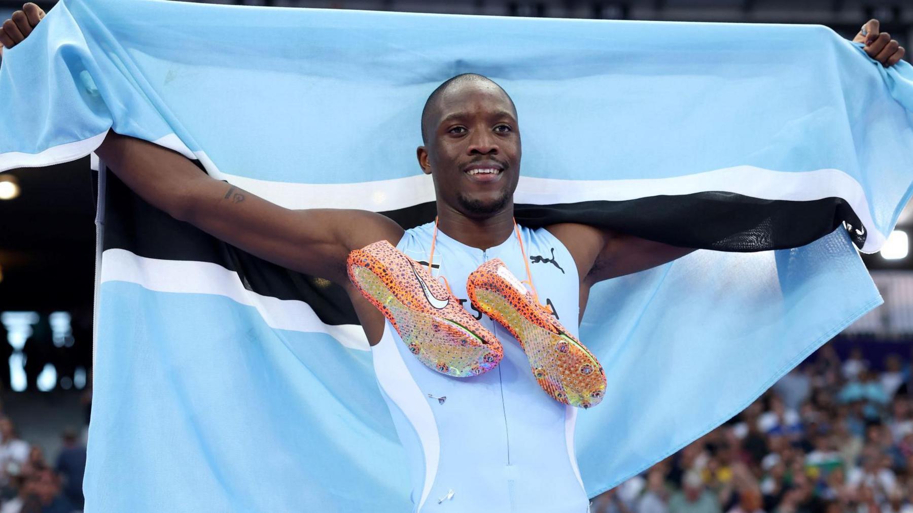 Letsile Tebogo with Botswana flag